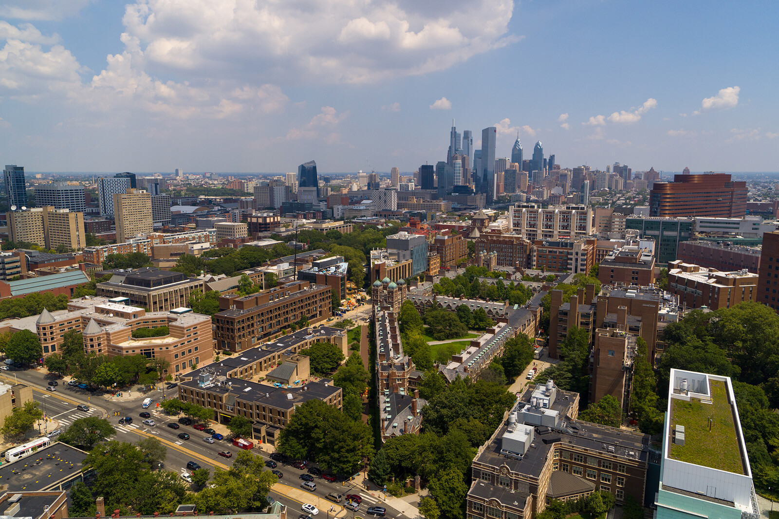 An aerial photograpgraph showing the historic Quadrangle with the Philly skyline in the background