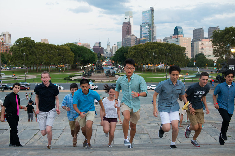 Incoming freshmen run up the Rocky steps in front of the Philadelphia Museum of Art during New Student Orientation