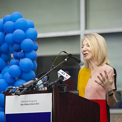 President Gutmann delivers remarks in front of the Penn Alexander School during the National Blue Ribbon ceremony 